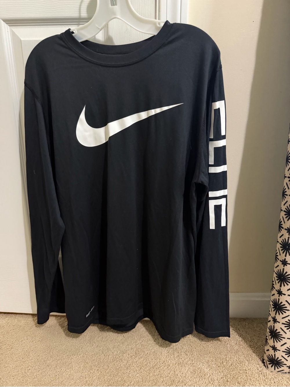 Nike Black Long-Sleeve Shirt with White Swoosh and Sleeve Graphic